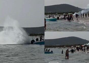 Sbarcano a Is Arenas Biancas in mezzo ai bagnanti e fanno festa con i fuochi d’artificio